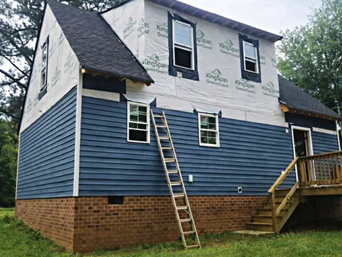 Restored home exterior with replaced siding by 27 Contracting in Central Virginia